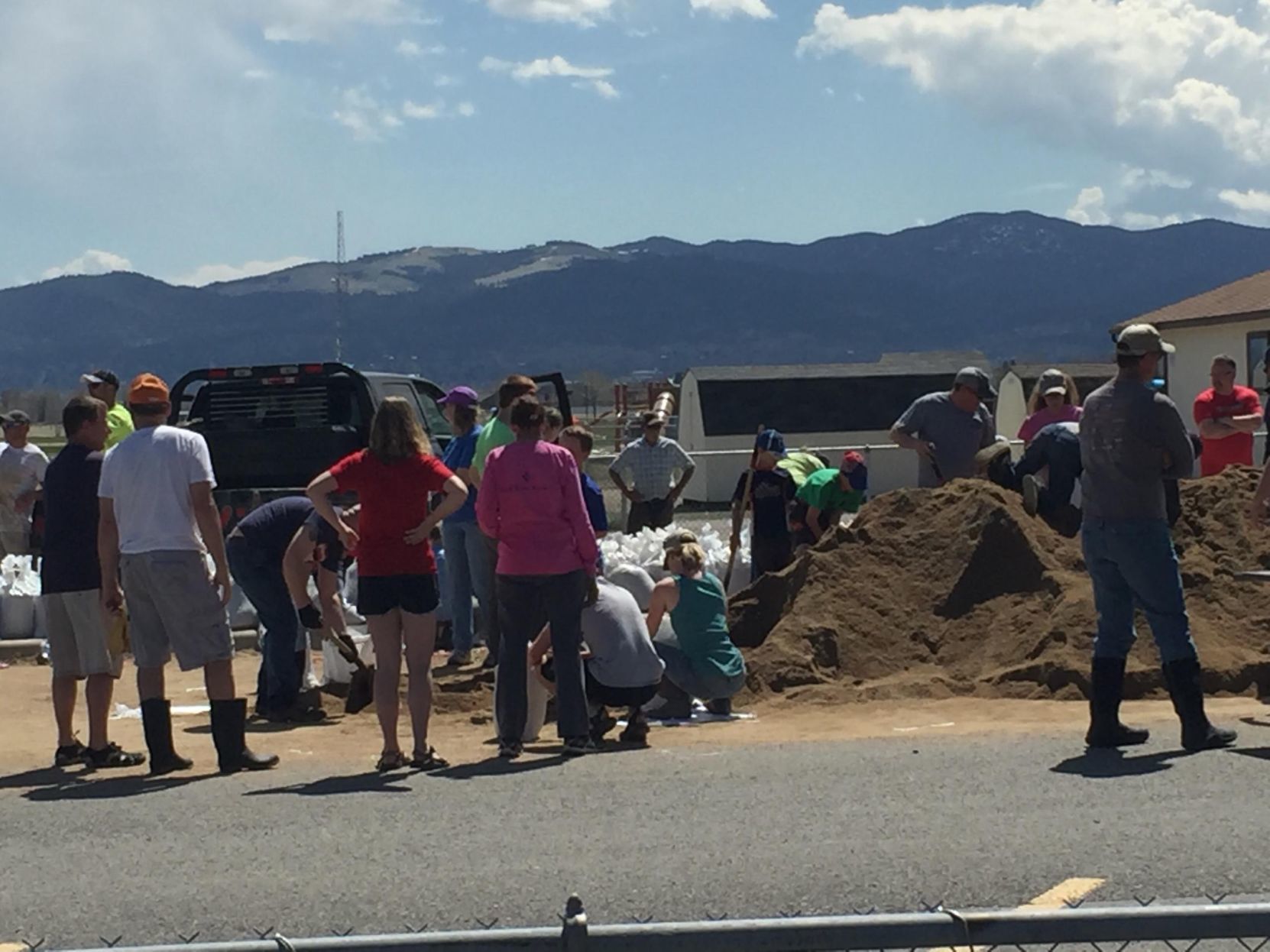Volunteers fill sandbags to place around Rossiter